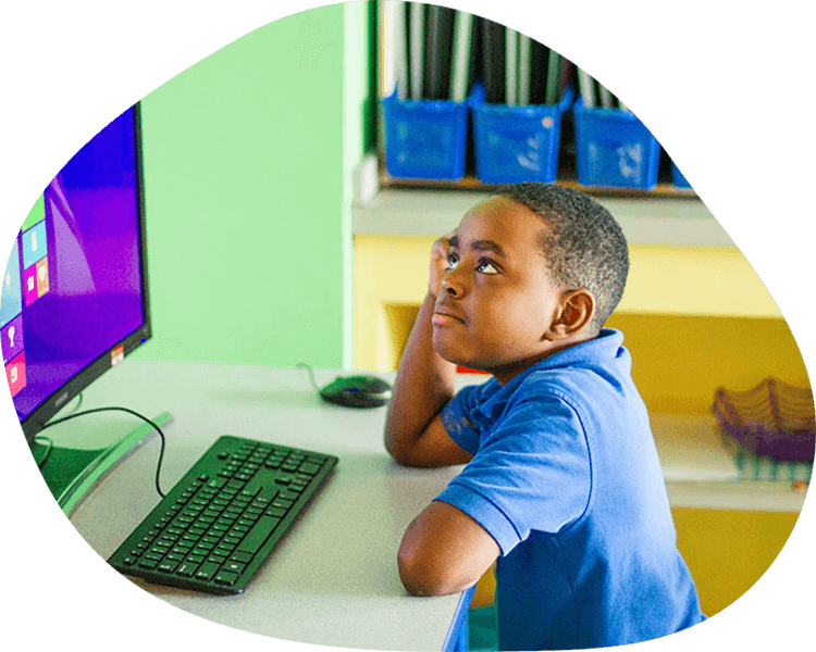 Thinking boy using a computer